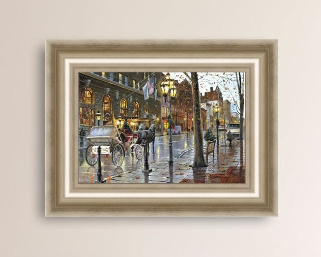 A canvas print depicting a Christmas scene with a horse-drawn carriage on a wet main street in Bethlehem with stores and Christmas lights in the background.
