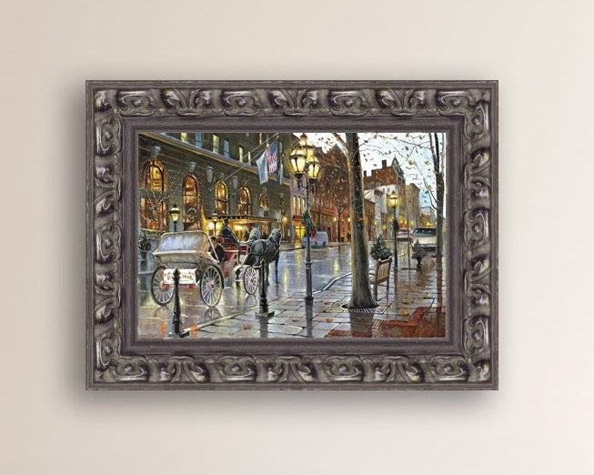 A canvas print depicting a Christmas scene with a horse-drawn carriage on a wet main street in Bethlehem with stores and Christmas lights in the background.