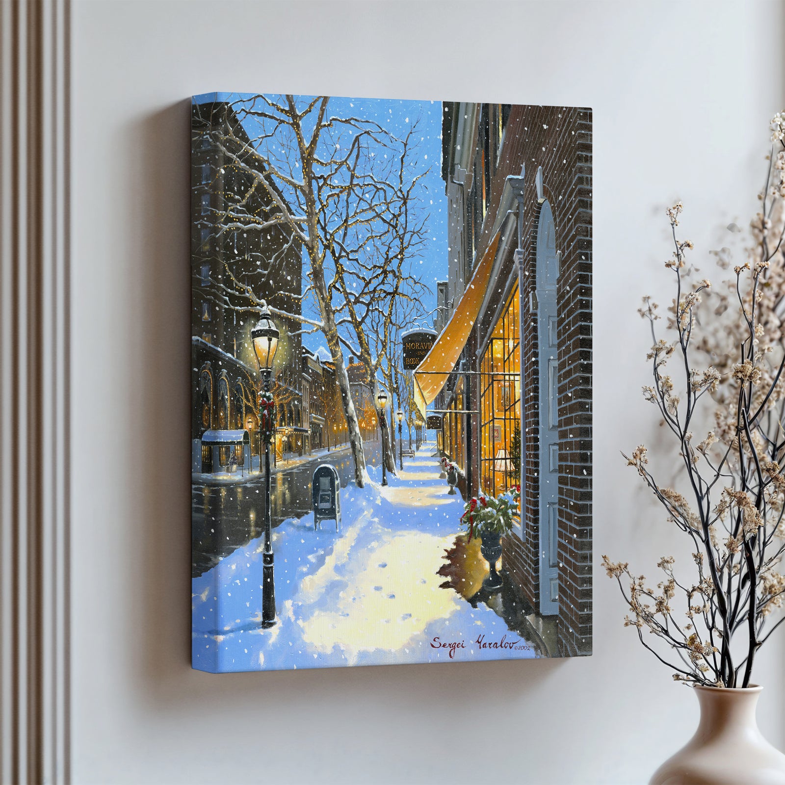 A canvas print of Moravian Bookshop, a snowy street scene in Bethlehem with footprints on the snow.