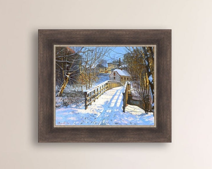 A framed canvas print featuring a Monocacy Bridge with snow on the ground, surrounded by trees and a historic Bethlehem building in the background.