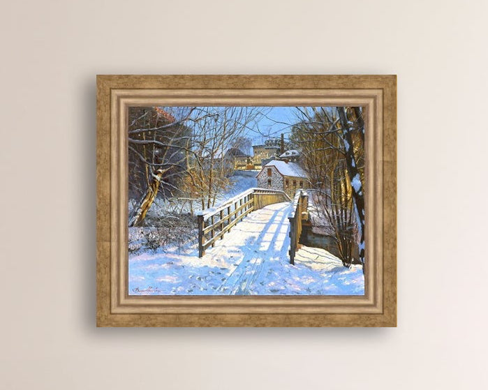 A canvas print featuring a Monocacy Bridge with snow on the ground, surrounded by trees and a historic Bethlehem building in the background.