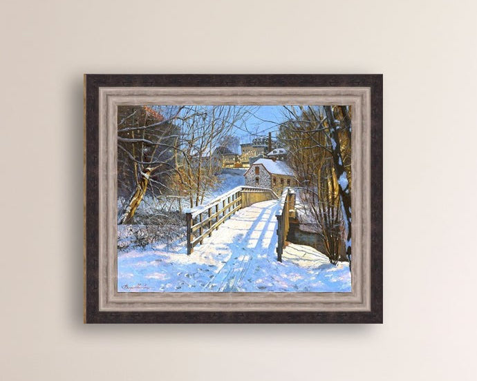 A canvas print featuring a Monocacy Bridge with snow on the ground, surrounded by trees and a historic Bethlehem building in the background.