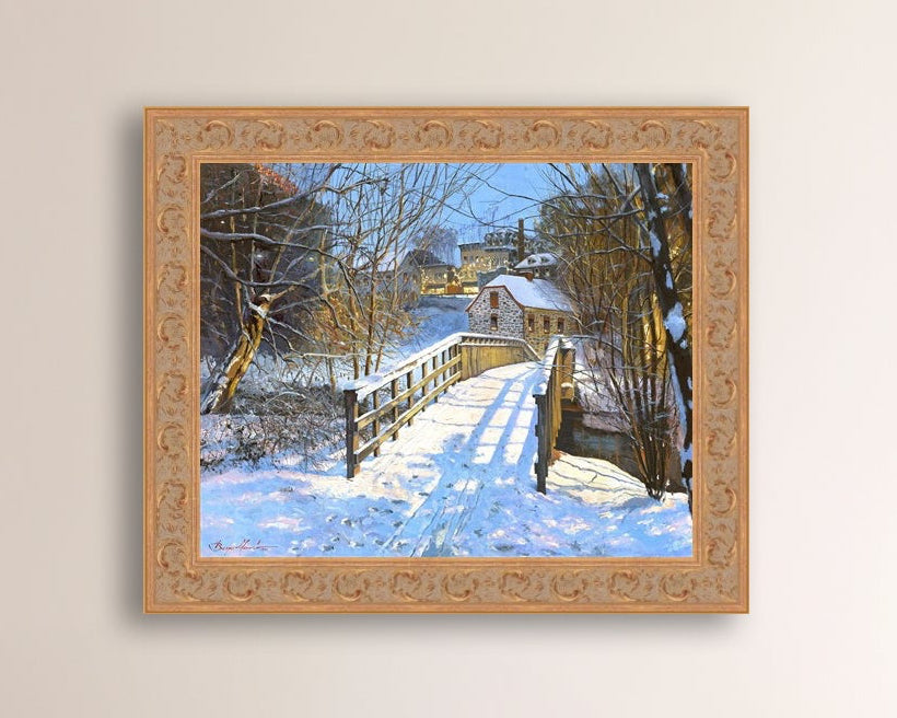 A framed canvas print featuring a Monocacy Bridge with snow on the ground, surrounded by trees and a historic Bethlehem building in the background.