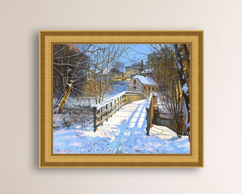 A framed canvas print featuring a Monocacy Bridge with snow on the ground, surrounded by trees and a historic Bethlehem building in the background.