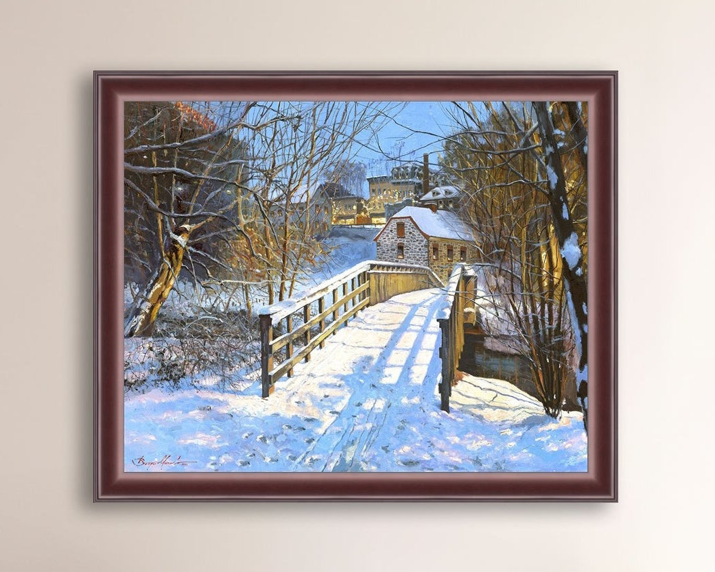 A framed canvas print featuring a Monocacy Bridge with snow on the ground, surrounded by trees and a historic Bethlehem building in the background.