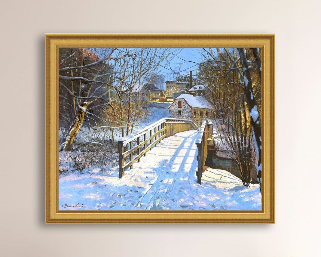 A framed canvas print featuring a Monocacy Bridge with snow on the ground, surrounded by trees and a historic Bethlehem building in the background.