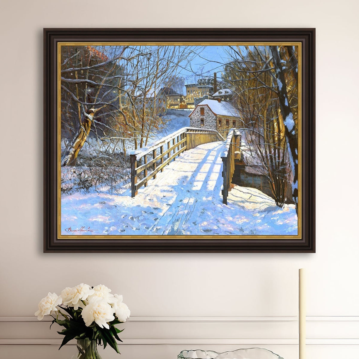 A framed canvas print featuring a Monocacy Bridge with snow on the ground, surrounded by trees and a historic Bethlehem building in the background.