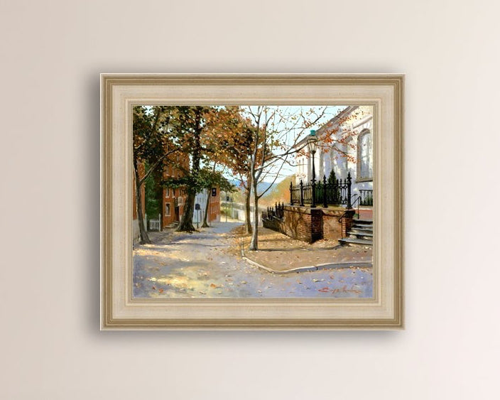 A canvas print featuring a vibrant street scene with trees and a building, titled 'Autumn Leaves on Church Street', Bethlehem 