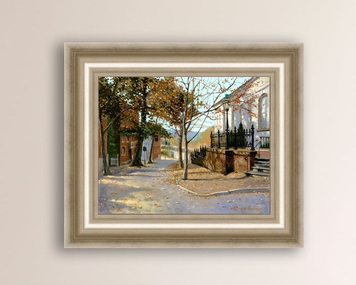 A canvas print featuring a vibrant street scene with trees and a building, titled 'Autumn Leaves on Church Street', Bethlehem 