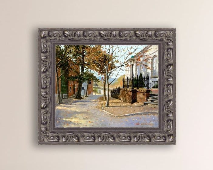 A canvas print featuring a vibrant street scene with trees and a building, titled 'Autumn Leaves on Church Street', Bethlehem 
