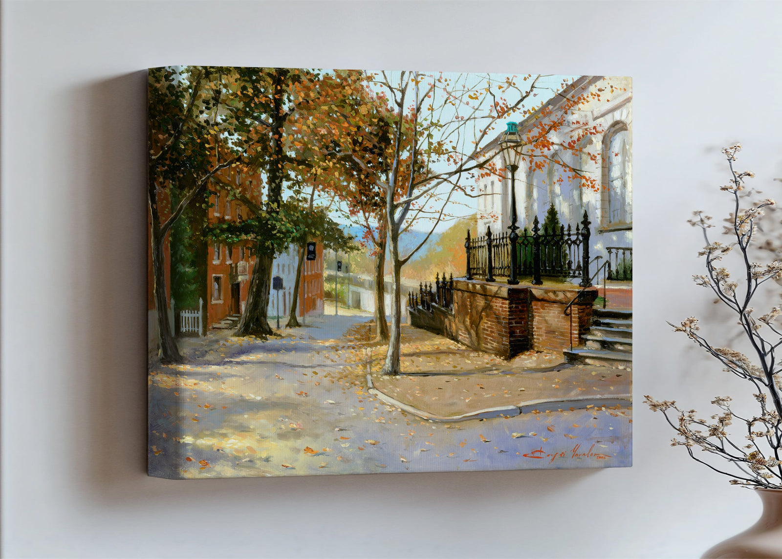 A canvas print featuring a vibrant street scene with trees and a building, titled 'Autumn Leaves on Church Street', Bethlehem 