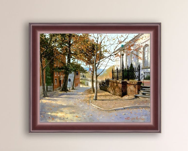 A canvas print featuring a vibrant street scene with trees and a building, titled 'Autumn Leaves on Church Street', Bethlehem 
