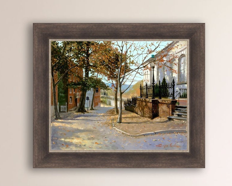 A canvas print featuring a vibrant street scene with trees and a building, titled 'Autumn Leaves on Church Street', Bethlehem 