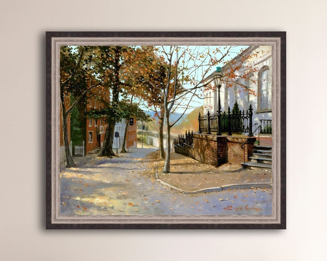 A canvas print featuring a vibrant street scene with trees and a building, titled 'Autumn Leaves on Church Street', Bethlehem 