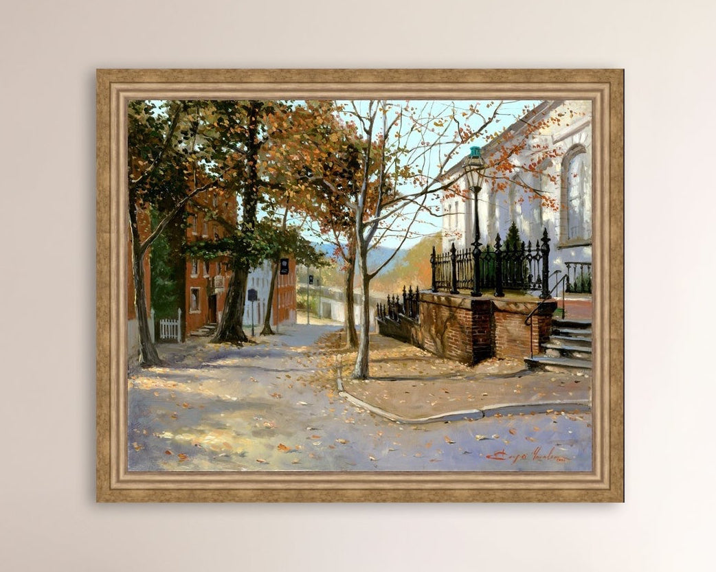 A canvas print featuring a vibrant street scene with trees and a building, titled 'Autumn Leaves on Church Street', Bethlehem 
