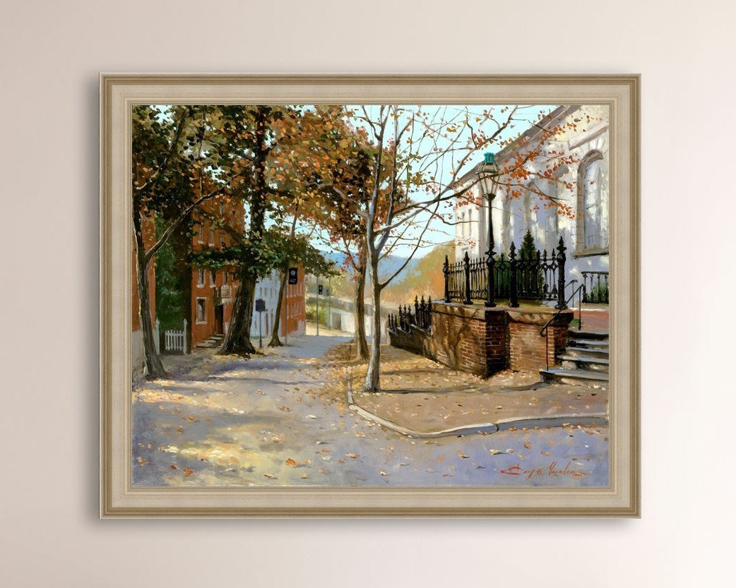 A canvas print featuring a vibrant street scene with trees and a building, titled 'Autumn Leaves on Church Street', Bethlehem 