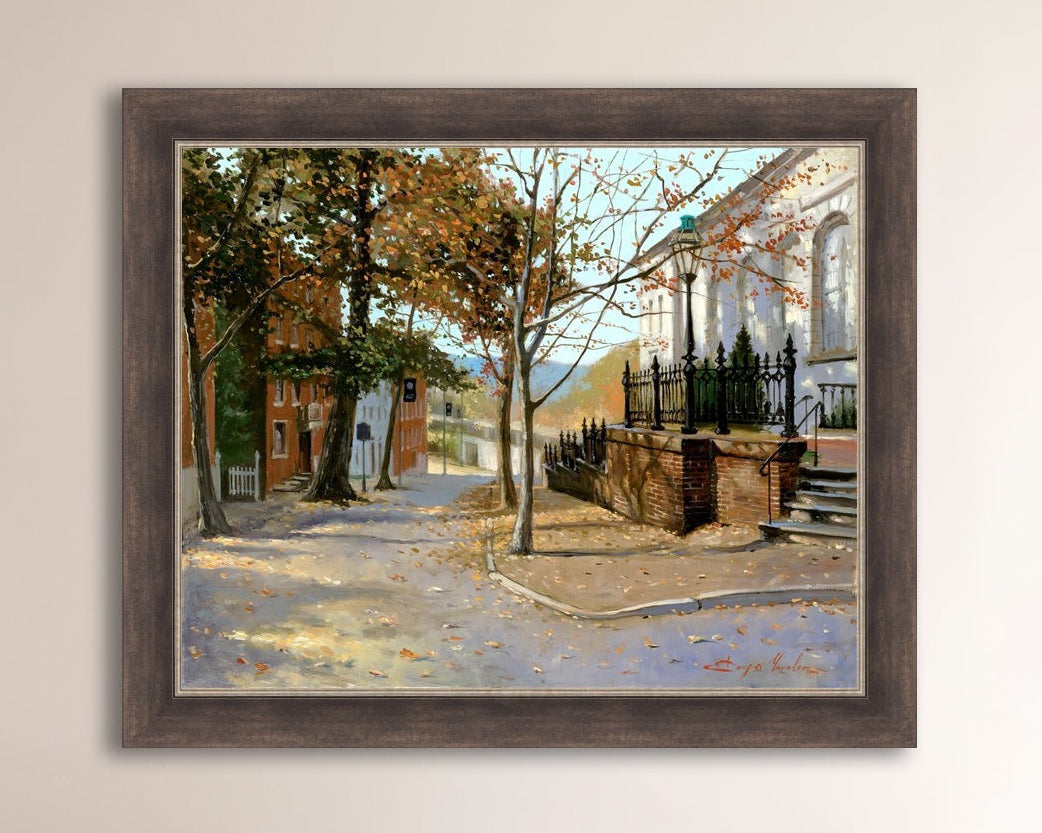 A canvas print featuring a vibrant street scene with trees and a building, titled 'Autumn Leaves on Church Street', Bethlehem 