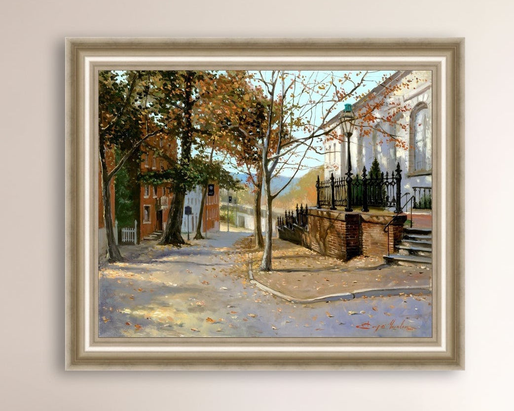 A canvas print featuring a vibrant street scene with trees and a building, titled 'Autumn Leaves on Church Street', Bethlehem 