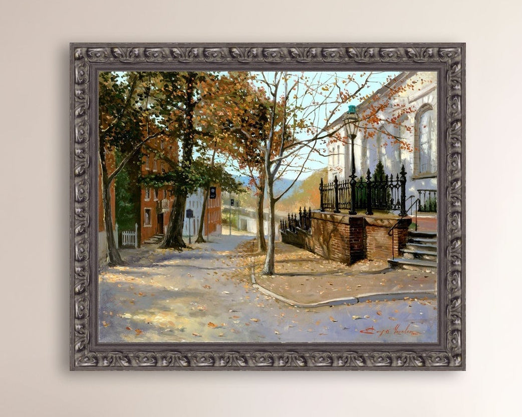 A canvas print featuring a vibrant street scene with trees and a building, titled 'Autumn Leaves on Church Street', Bethlehem 