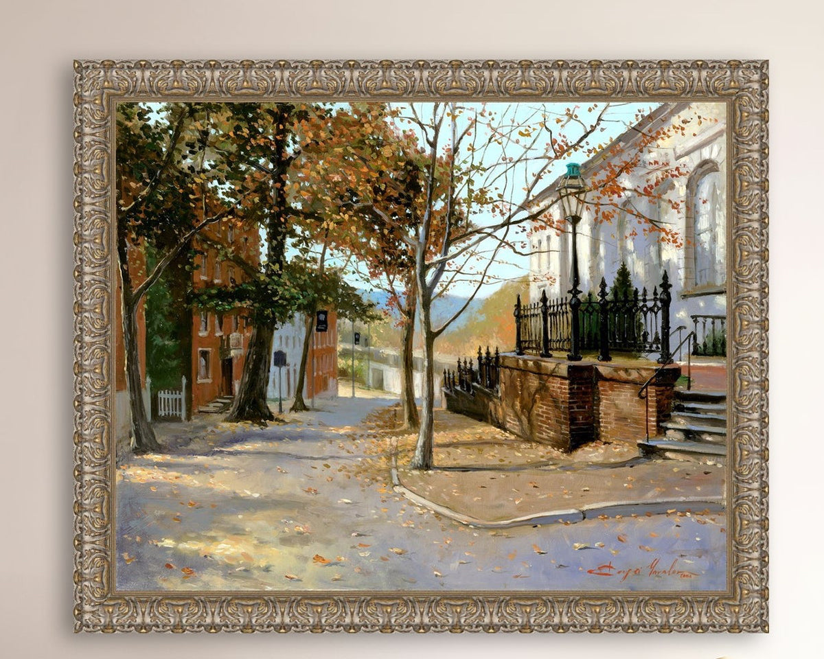 A canvas print featuring a vibrant street scene with trees and a building, titled 'Autumn Leaves on Church Street', Bethlehem 