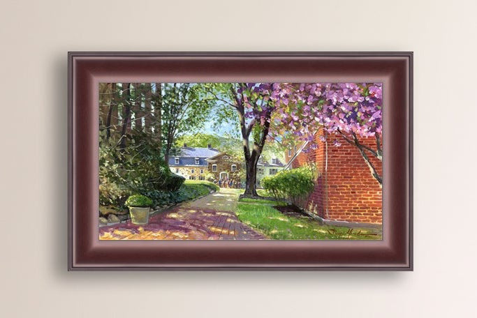 A canvas print depicting a vibrant spring scene with a pathway, trees in bloom, and a historic Moravian Chapel in the background.