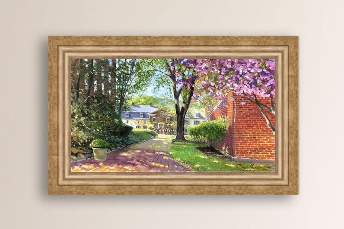 A canvas print depicting a vibrant spring scene with a pathway, trees in bloom, and a historic Moravian Chapel in the background.