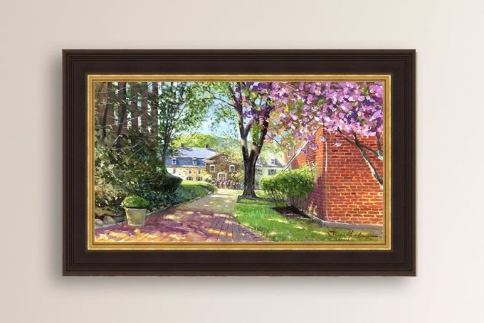 A canvas print depicting a vibrant spring scene with a pathway, trees in bloom, and a historic Moravian Chapel in the background.