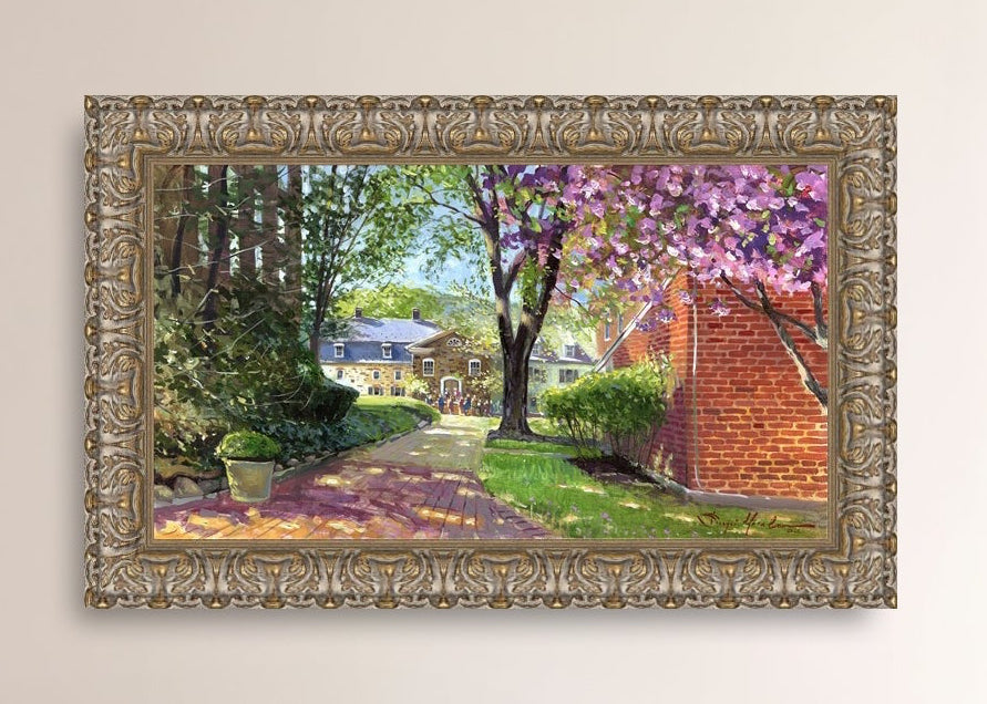 A canvas print depicting a vibrant spring scene with a pathway, trees in bloom, and a historic Moravian Chapel in the background.