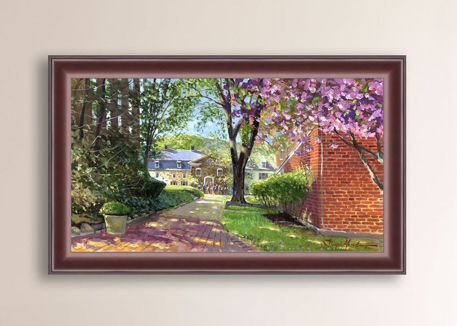 A canvas print depicting a vibrant spring scene with a pathway, trees in bloom, and a historic Moravian Chapel in the background.