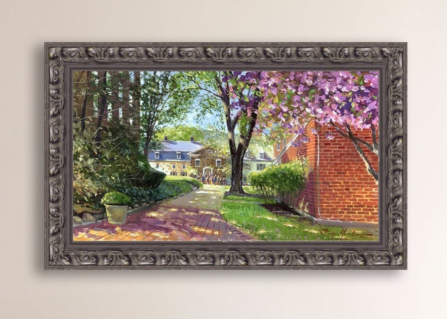 A canvas print depicting a vibrant spring scene with a pathway, trees in bloom, and a historic Moravian Chapel in the background.
