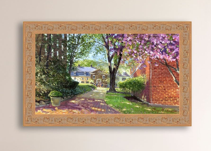 A canvas print depicting a vibrant spring scene with a pathway, trees in bloom, and a historic Moravian Chapel in the background.