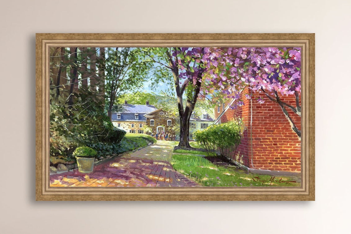 A canvas print depicting a vibrant spring scene with a pathway, trees in bloom, and a historic Moravian Chapel in the background.
