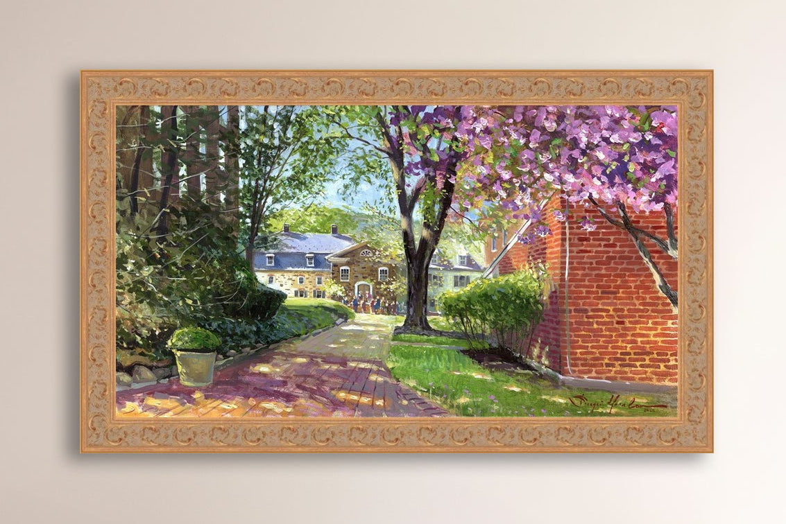 A canvas print depicting a vibrant spring scene with a pathway, trees in bloom, and a historic Moravian Chapel in the background.