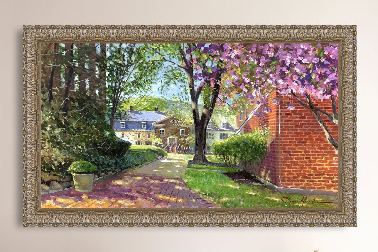 A canvas print depicting a vibrant spring scene with a pathway, trees in bloom, and a historic Moravian Chapel in the background.