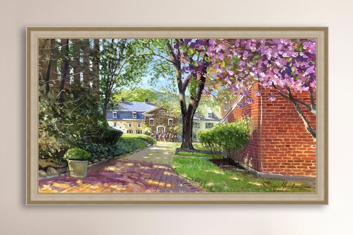 A canvas print depicting a vibrant spring scene with a pathway, trees in bloom, and a historic Moravian Chapel in the background.