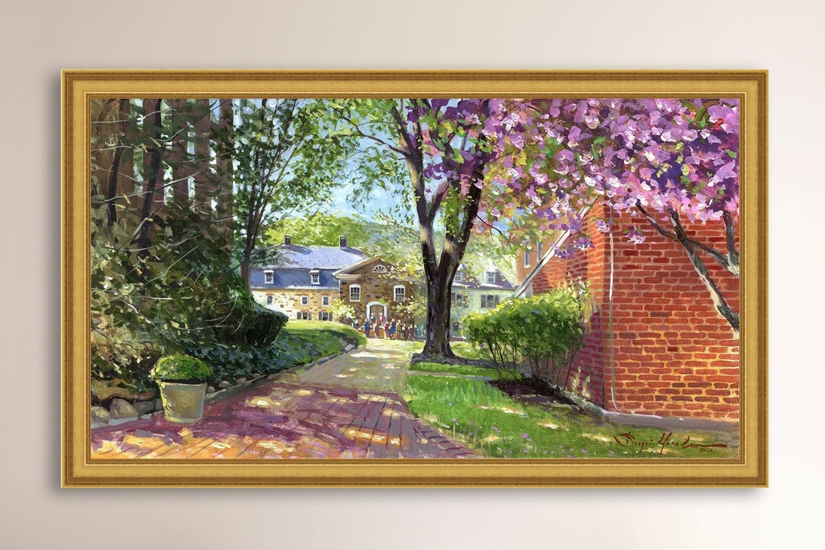 A canvas print depicting a vibrant spring scene with a pathway, trees in bloom, and a historic Moravian Chapel in the background.