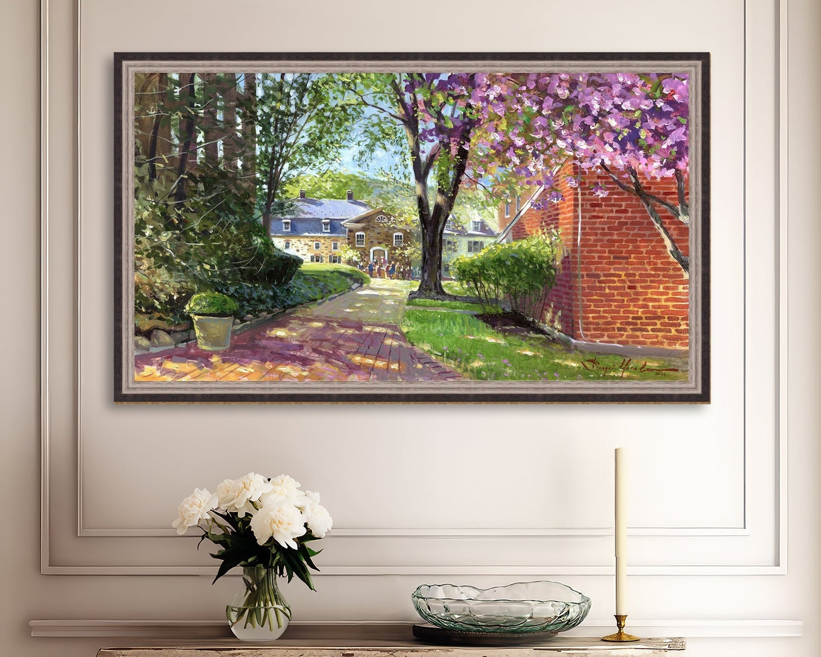 A canvas print depicting a vibrant spring scene with a pathway, trees in bloom, and a historic Moravian Chapel in the background.