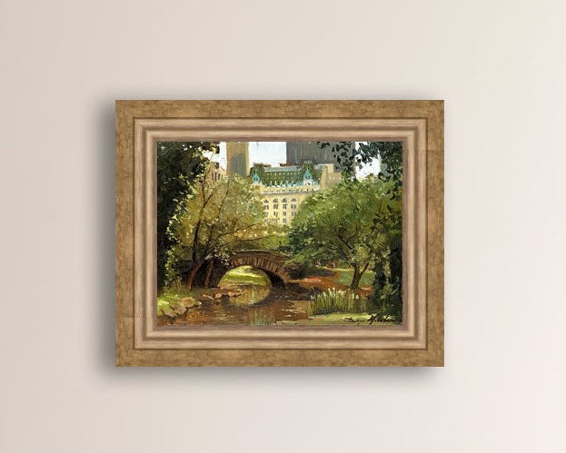 A canvas print of 'Summer in Central Park, New York' featuring bridge in the park and Plaza Hotel in the background.