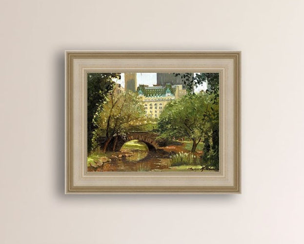 A canvas print of 'Summer in Central Park, New York' featuring bridge in the park and Plaza Hotel in the background.