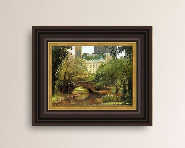 A canvas print of 'Summer in Central Park, New York' featuring bridge in the park and Plaza Hotel in the background.