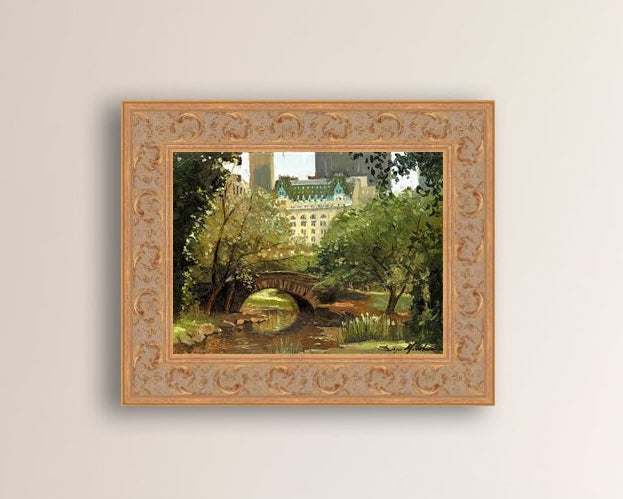 A canvas print of 'Summer in Central Park, New York' featuring bridge in the park and Plaza Hotel in the background.