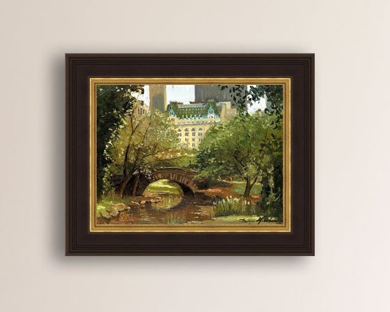 A canvas print of 'Summer in Central Park, New York' featuring bridge in the park and Plaza Hotel in the background.