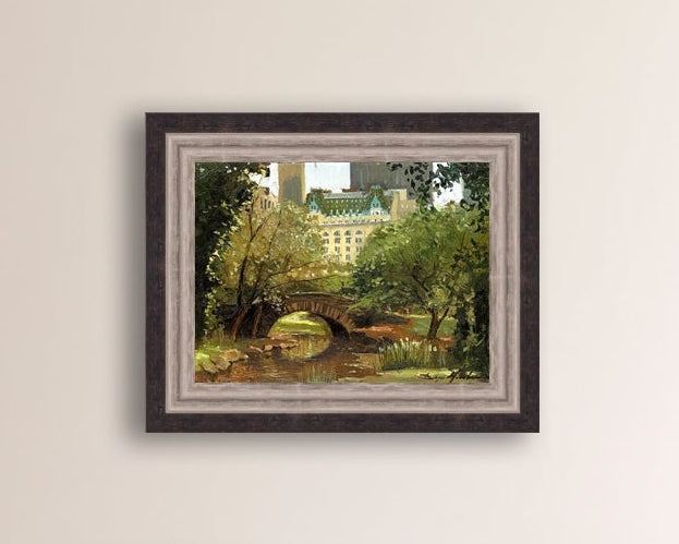 A canvas print of 'Summer in Central Park, New York' featuring bridge in the park and Plaza Hotel in the background.