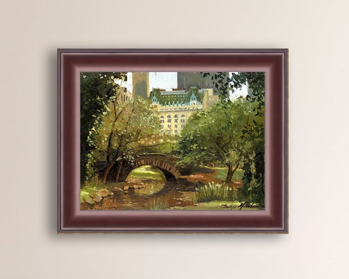 A canvas print of 'Summer in Central Park, New York' featuring bridge in the park and Plaza Hotel in the background.