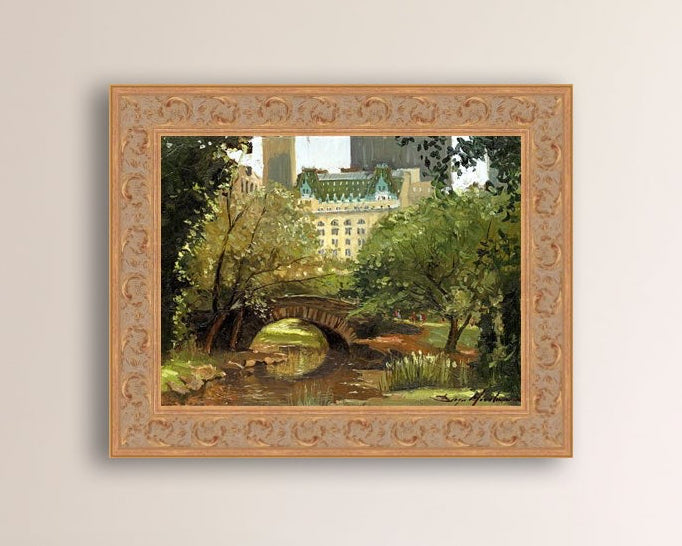 A canvas print of 'Summer in Central Park, New York' featuring bridge in the park and Plaza Hotel in the background.