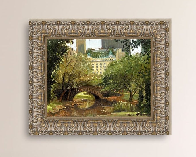 A canvas print of 'Summer in Central Park, New York' featuring bridge in the park and Plaza Hotel in the background.