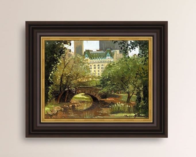 A canvas print of 'Summer in Central Park, New York' featuring bridge in the park and Plaza Hotel in the background.
