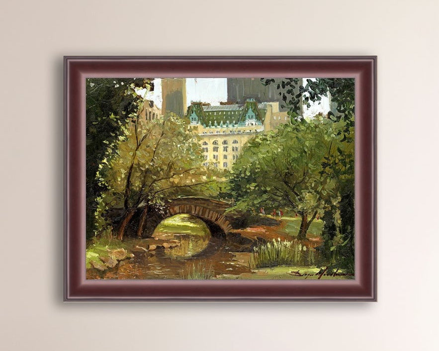 A canvas print of 'Summer in Central Park, New York' featuring bridge in the park and Plaza Hotel in the background.