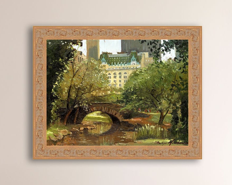 A canvas print of 'Summer in Central Park, New York' featuring bridge in the park and Plaza Hotel in the background.