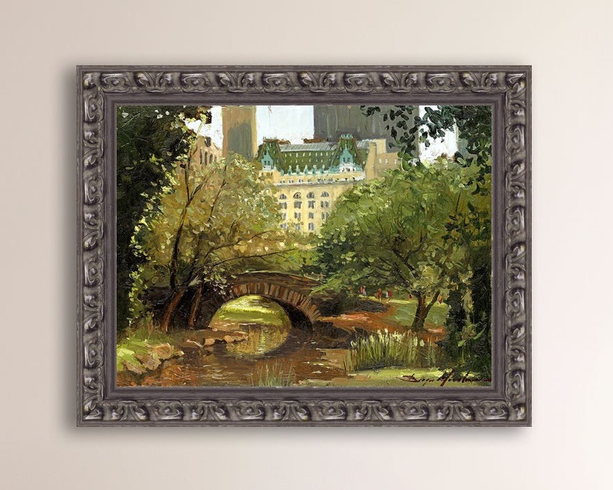 A canvas print of 'Summer in Central Park, New York' featuring bridge in the park and Plaza Hotel in the background.